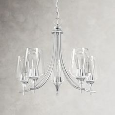 a glass chandelier hanging from a ceiling