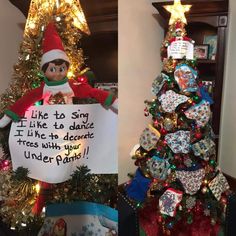 an elf holding a sign next to a christmas tree