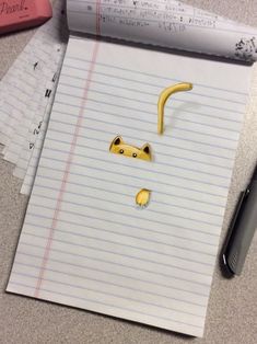 a piece of paper that has been cut out to look like a banana and cat