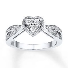 a heart shaped diamond ring on a white background