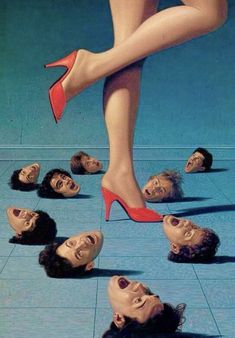 a woman's feet with several heads on the floor and one in red high heels