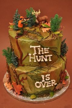 the hunt is over cake with deer and trees on top