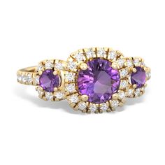 Regal and bold, this three stone halo amethyst with  and  ring gleams in 14K Yellow Gold with {diamondcarats}. Choose one gem, two gems, or even three different gems to create an everlasting family keepsake. Amethyst Wedding Rings, Amethyst Ring Vintage, Amethyst Wedding, American Diamond Jewellery, Amethyst Ring Engagement, Purple Amethyst Ring, Amethyst And Diamond Ring, Amethyst Jewelry, Ring Unique