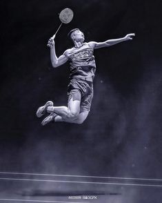 a man jumping in the air with a tennis racket