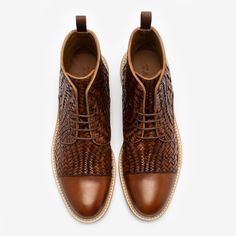 Meet the Rome Boot in Woven. One of our most popular boot styles is now available in a full-grain, woven leather silhouette. This boot is literally a work of art, featuring details and craftsmanship you cannot find anywhere else. We spared no expense on this boot and the comfort and quality will show from the moment you put them on. Handmade in Spain Upper: Full-grain woven leather Outsole: Leather sole with rubber inserts Blake Construction Standard D Width | The Rome Boot in Woven Brown size 6 Woven Leather Shoes With Round Toe, Brown Woven Leather Shoes, Brown Woven Leather Shoes With Round Toe, Luxury Brown Chukka Ankle Boots, Luxury Brown Ankle Chukka Boots, Luxury Brown Chukka Boots With Leather Sole, Luxury Ankle Boots With Textured Sole, Brown Woven Leather Boots, Luxury Brown Chukka Boots With Rubber Sole