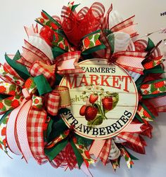 a farmer's market wreath with strawberries on it