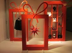 an orange display case with a red star hanging from it's side