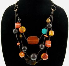 Pinterest Adjustable Double Strand Necklaces With Wooden Beads, Adjustable Double Strand Necklace With Wooden Beads, Adjustable Multi-strand Wooden Bead Jewelry, Amber Wooden Beads For Jewelry Making, Brown Multi-strand Necklace With Polished Beads, Brown Beaded Chain Costume Jewelry, Long Brown Necklace With Colorful Beads, Bohemian Amber Beaded Chain Jewelry, Brown Multi-strand Jewelry With Colorful Beads