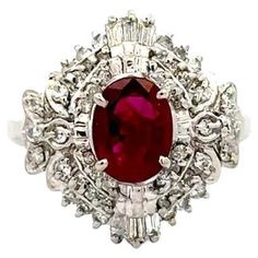 Simply Beautiful! Vintage Burma Ruby GIA and Diamond Platinum Ring. Centering a securely Hand set Oval Burma Ruby GIA, weighing approx. 1.08 Carat. Surrounded by Diamonds, approx. 0.47tcw. GIA Certificate # 7482203508. Hand crafted Platinum mounting. Ring size 5.5, we offer ring resizing. Sophisticated cool! In excellent vintage condition, recently professionally cleaned and polished. More Beautiful in real time! Ideal worn alone or as an alternative Engagement ring. Sure to be admired…Illuminating your look with Timeless Beauty! Gia Certificate, Alternative Engagement Ring, Platinum Diamond Rings, Alternative Engagement Rings, Platinum Ring, Gia Diamond, Cocktail Ring, Simply Beautiful, Cocktail Rings