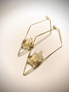 "Light weight, beautiful quartz crystal drop earrings. With healing properties and positive vibes, these earrings will bring a whole new light to your daily routine.  This listing is for one pair of earrings.  Aprox length: 3\"-3.5\" Aprox Width: 1\"-1.5\" Each set is unique and slightly different, that is the nature of using raw stones.   Each package will be gift wrapped.  Personal note can be sent with earrings if being shipped as a gift, just message me after purchase" Minimalist Wire Wrapped Crystal Drop Earrings, Minimalist Wire Wrapped Crystal Dangle Earrings, Minimalist Wire Wrapped Crystal Earrings As Gift, Handmade Minimalist Crystal Dangle Earrings, Handmade Minimalist Dangle Crystal Earrings, Handmade Crystal Drop Earrings For Healing, Minimalist 14k Gold-filled Earrings With Natural Stones, Minimalist 14k Gold Filled Earrings With Natural Stones, Raw Crystal Earrings