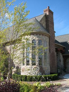 a large brick house with lots of windows