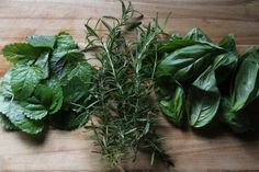 herbs on a cutting board ready to be cooked