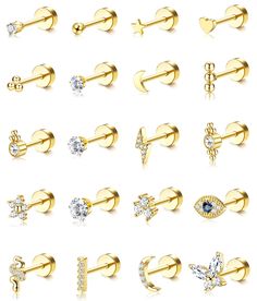 various types of earrings and piercings on a white background