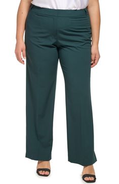 Stretch is built into sleek highline pants that are crafted with minimalistic details and double welt pockets. 32.25" inseam Zip fly with hook-and-bar closure Back double-welt pockets 63% polyester, 33% rayon, 4% spandex Dry clean Imported Model stats: 5'10" height, 41" bust, 36" waist, 48" hip. Model is wearing size 1X Modern Fitted Calvin Klein Bottoms, Office Work Pants With Welt Pockets In Solid Color, Solid Flat Front Pants For Work, Calvin Klein Wide Leg Bottoms For Fall, Calvin Klein Bottoms For Office In Fall, Calvin Klein Straight Leg Workwear Pants, Calvin Klein Workwear Pants With Straight Leg, Calvin Klein Pants For Spring Workwear, Calvin Klein Formal Bottoms For Fall