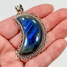 I Just Love The Mystical Internal Shine Of Labradorite! This Is A Large Crescent Moon Pendant. I Had The Stone Specially Cut For This Design. The Labradorite Is Large And Nice And Thick. The Internal Chatoyance Is Really Pretty And A Bit Unique As It Has A Lined Pattern To It. This Is Set Into A Sterling Bezel That Is Framed With A Twisted Silver Wire Accent. Sterling Scalloped Heart Loops Frame The Piece For More Detail. It Is Finished Off With A Beautiful Coordinating Bail! ***This Is One Of S Mystical Blue Labradorite Jewelry, Silver Labradorite Moon-shaped Jewelry, Blue Mystical Moon Charm Jewelry, Mystical Blue Moon Charm Jewelry, Nickel-free Blue Labradorite Jewelry, Blue Labradorite Bohemian Jewelry, Bohemian Blue Labradorite Jewelry, Blue Crescent Gemstone Jewelry, Angel Pendant Necklace