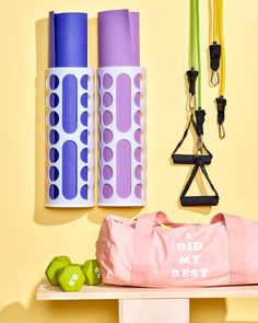 there is a yoga mat, bag and other items on the shelf