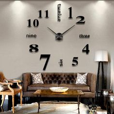 a living room filled with furniture and a large clock mounted to the wall above it