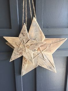 a wooden star hanging from a door