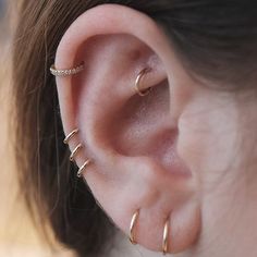 a woman with ear piercings on her ears and the caption reads,'congratulations looks just cool with hoops as studs we did three hops to build space between