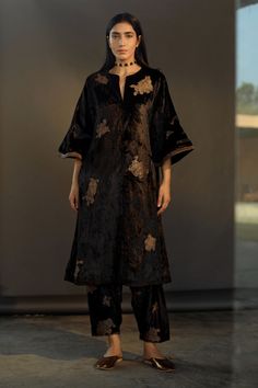 Black velvet flared kurta with brocade embroidered floral motifs. Comes with pant.
Components:2
Embroidery
Neckline:Notched
Sleeve Length:Three fourth
Fabric:Velvet
Color:Black
Brocade patch work
Flared sleeves
Side pockets on kurta
Floral motifs on pant with scallop hem
Note: Dupatta worn by model is not for sale. - Aza Fashions Best Designer Suits, Velvet Kurta, Velvet Flares, Embroidered Velvet, Bridal Jewelry Collection, Patch Work, Kurta With Pants, Velvet Color, Velvet Pants