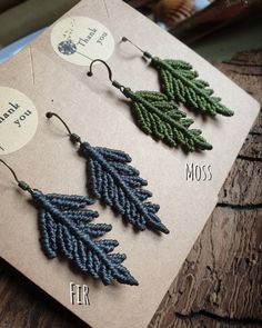 the earrings are made out of beads with leaves on each earring and beading