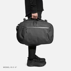 Travel Duffel - Black — Aer | Modern gym bags, travel backpacks and laptop backpacks designed for city travel Versatile Duffle Bag With Functional Pockets For On-the-go, Practical Large Capacity Travel Accessories For On-the-go, Functional On-the-go Travel Bag With Zipper Pocket, Functional Bags With Luggage Sleeve For Commuting, Functional Commuter Bags With Luggage Sleeve, Functional Commuting Bags With Luggage Sleeve, Functional Nylon Luggage For On-the-go, Modern Nylon Luggage For On-the-go, Practical Everyday Luggage With Zipper Closure