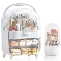 an image of a cosmetic case with makeup brushes and other items in it on a white background