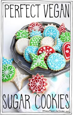 a plate full of sugar cookies with the words perfect vegan written in front of it