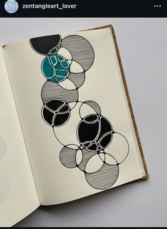 an open book with black and white circles on it