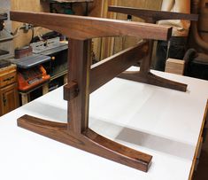 a close up of a piece of wood on top of a white countertop in a shop