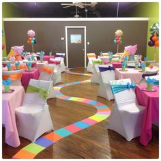 the facebook page for an event with colorful tables and chairs on it's side