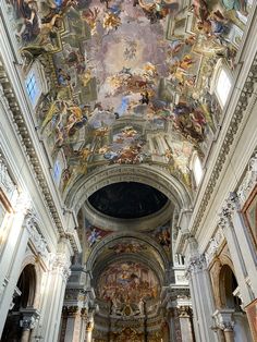 the interior of a church with paintings on the ceiling