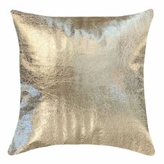 a gold and silver pillow with metallic foil on the front, it's square shape