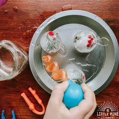 someone is decorating an easter egg with plastic eggs