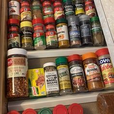 an organized spice rack with spices and seasonings