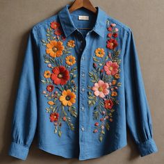 a blue shirt with colorful flowers on it