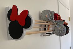 the mickey mouse head is hanging on the wall