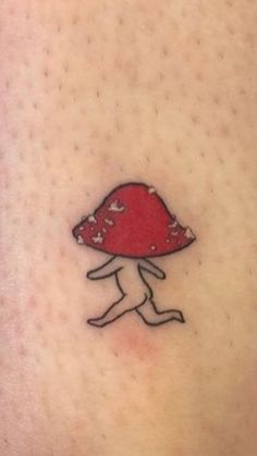 a small mushroom tattoo on the back of a woman's stomach, it looks like she is running