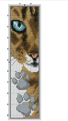 a cross stitch bookmark with an image of a cat's face