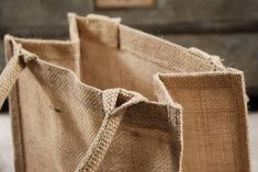 two jute bags sitting on top of a table