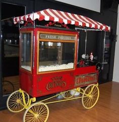 an old fashioned popcorn cart is on display