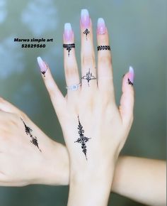 two hands with different designs on their fingers