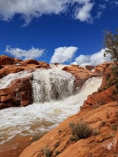 a large waterfall with water coming out of it