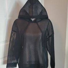 This Puffy Sheer Hoodie Is Made If A Double Layer Mesh Material That Holds Its Shape. I Loved It When I First Saw It In The Store And Still Do But It Just Never Makes Its Wsy Out Of My Closet. Figured I'd List It And See If It Sells Before I Decide To Finally Wear It. Never Worn. New Without Tags. *Don't Forget To Bundle And Save* Black Tops With Adjustable Hood For Spring, Black Tops With Double-lined Hood For Spring, Black Spring Tops With Adjustable Hood, Sheer Hoodie, Mesh Hoodie, Mesh Material, Colorful Hoodies, Black Mesh, New Black