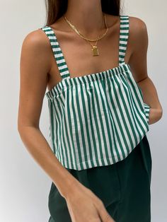 The Sabina Top is a boxy cropped tank created from our custom woven cool-to-the-touch cotton poplin, inspired by classic vintage shirting. The Sabina boasts an effortless and easy cropped fit perfect for pairing with high-waisted trousers and shorts. Worn alongside our newly released Lena Pants in Striped Poplin or the Chloe Shorts- the Sabina is sure to become your next go-to piece for year-round wear! Made in USA Sewing Projects Crop Top, Women’s Tops Sewing Patterns, Effortless Cotton Cropped Top, Effortless Cropped Cotton Crop Top, Everyday Cotton Cropped Hem Tops, Cotton Cropped Hem Tops For Everyday, Cotton Relaxed Fit Crop Top Tank, Cropped Cotton Tops For Everyday, Relaxed Fit Cotton Crop Top Tank