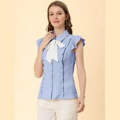 Enjoy a relaxed style with this bow-tie button-down ruffled shirt. It features ruffled details at the front. This white peter-pan-collar blouse is cute and sweet. This cute shirt is a wardrobe invigoration, and it features peter-pan bowtie collar for what is sure to be a favorite for work or play. Get a fresh look wearing this shirt and pair it with jeans or skirt. Spring Casual Shirt With Bow, Feminine Office Tops With Bow Detail, Blue Collared Blouse With Ruffles, Blue Ruffled Collared Blouse, Spring Office Tops With Bow Detail, Chic Blue Tops With Bow, Chic Blue Top With Bow, Blue Collared Ruffle Top, Collared Tops With Bow For Spring