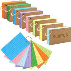 a bunch of different colored binders with paper attached to each one and the words 300ps on them