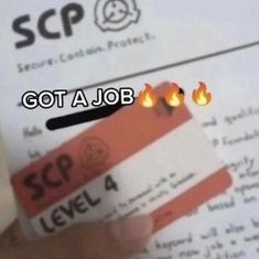 a person holding up a card with flames coming out of it and the text scp got a job