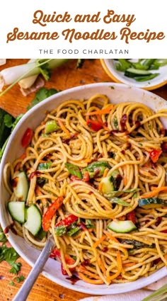 a white bowl filled with pasta and vegetables on top of a wooden table next to chopsticks