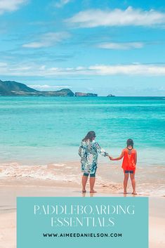 two girls on the beach holding hands with text overlay reading paddlebo arding essentials